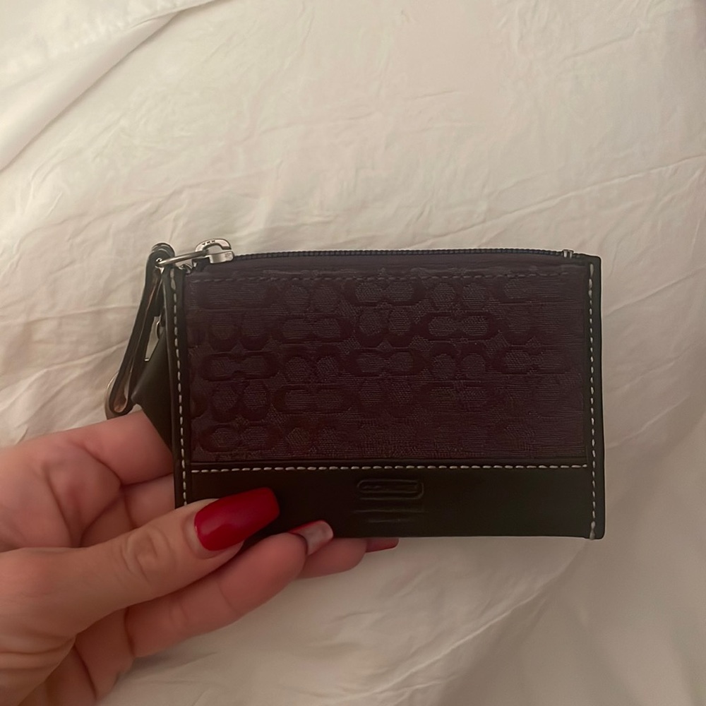 Purple coach coin purse.